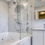 Frameless glass shower screen installed in a Canberra bathroom