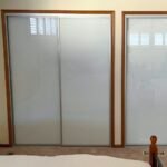 Sliding wardrobe door bottom track and roller repaired in a Canberra home